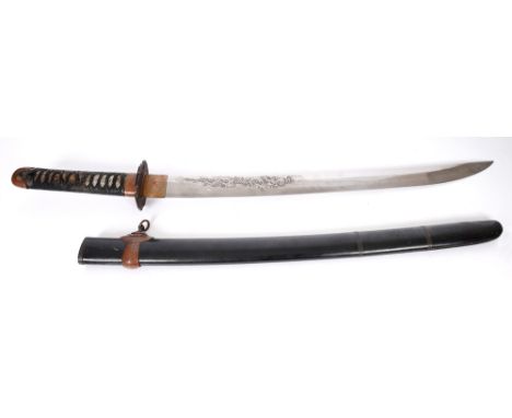Japanese sword. A Japanese Shinto tachi in black lacquer saya, the heavy blade decorated with a horimono of a dragon to one s