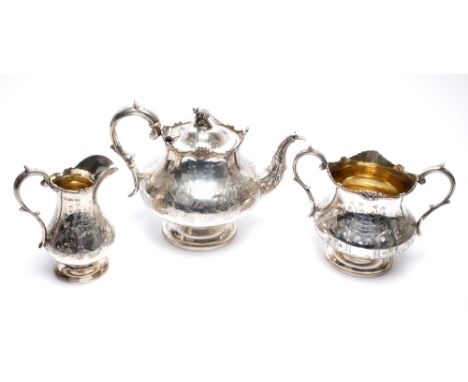 An early Victorian silver tea service. A three-piece Victorian silver baluster-shaped tea service the wavy rim with anthemion