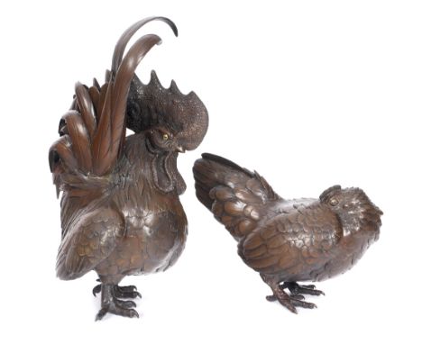 19th century Japanese bronze figures of a cockerel and a hen. A pair of Meiji bronzes, a cockerel, his chest puffed out and t