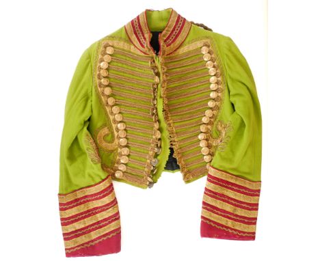 Irish Coachman's livery The short, hussar-style tunic of acid-green wool. Bullion corded front with forty-eight gilt-brass bu