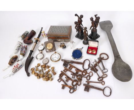 Miscellaneous lot of porcelain pipes, novelty sport trophy, iron door keys, military buttons. A large metal alloy spoon engra