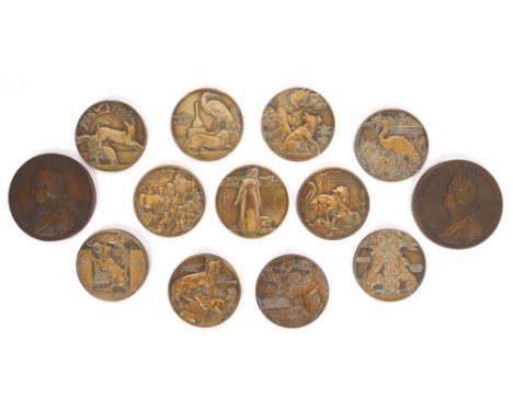 Bronze medallions, set of eleven after Jean Vernon and two depicting the bust of Louis XIV and Versailles. Eleven bronze meda