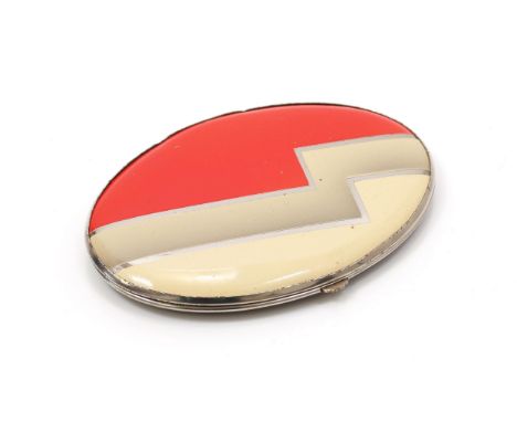 An 'Art Deco' style oval shaped powder compact, by Gwenda, the hinged lid decorated with a bold geometric design with polychr