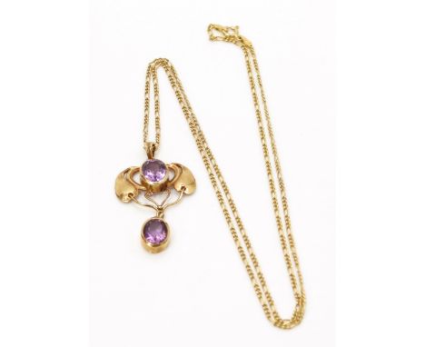 An 'Art Nouveau' style .925 gold plated silver and amethyst set pendant, in the manner of Murrle Bennett, suspended on a cont