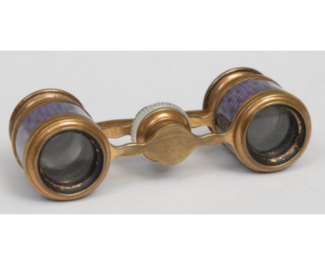 A pair of early 20th century French gilt brass, mother of pearl and guilloché enamel opera glasses, 9cm wide, c.1910 