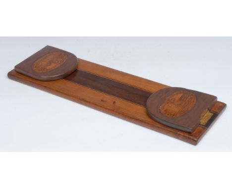 A 19th century Irish Killarney marquetry book stand, the arched folding end supports inlaid with views of Muckross Abbey, Co.