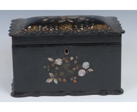 A Victorian papier mache shaped rectangular tea caddy. hinged cover enclosing a pair of lidded compartments, decorated in gil