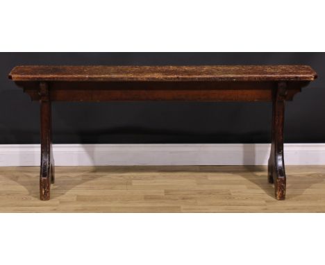 A late Victorian Gothic Revival vernacular pine bench, chamfered rectangular top, shaped end supports, 61cm high, 148.5cm wid