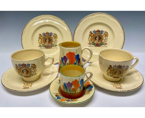 A Clarice Cliff Bizarre Crocus Pattern cream jug8.5cm, Wilkinson Pottery mark; a Clarice Cliff Crocus pattern coffee can and 