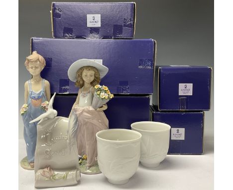 A Lladro figure, A Wish Come True, 7676, Annual Figure 1999, boxed; another, Pocketful of Wishes, 7650, boxed; Art Brings Us 