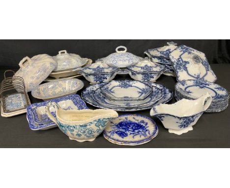 A Staffordshire Adams and Co. Tedworth pattern flow blue part dinner service, including sauce tureen and ladle on stand, sauc