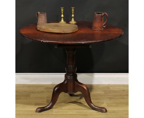 A George III mahogany tripod supper table, circular top, turned baluster pillar, cabriole legs, pad feet, 71cm high, 90cm dia