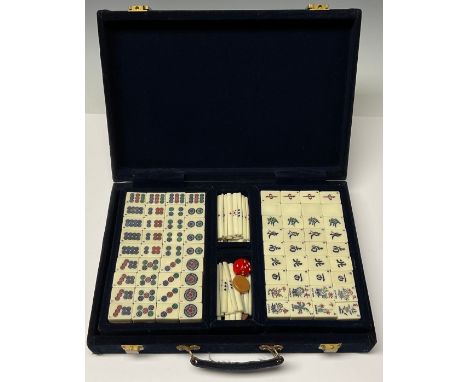 A Chinese Mahjong set, bamboo and resin pieces, in a blue velvet box, 31cm wide 