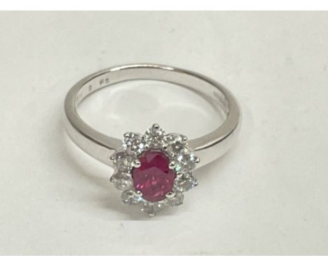 Certified 18ct white gold oval ruby and diamond cluster ring. Ruby 0.50ct. RBC DIAMONDS 0.50ct. Cert no. WGI9624126299