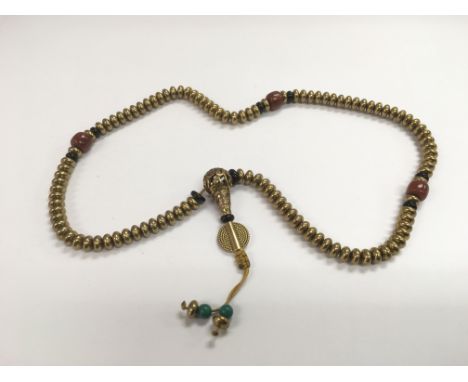 A Tibetan bronze bead necklace.