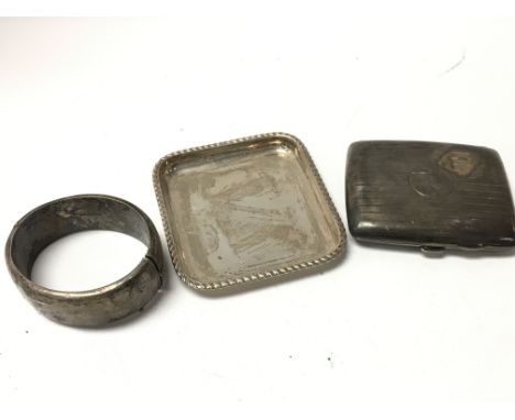 A small silver tray, cigarette case and bangle. Weighing in total approximately 187g.