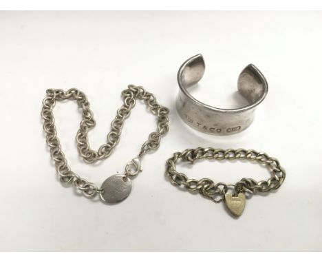 A silver bangle and two silver bracelets (3).