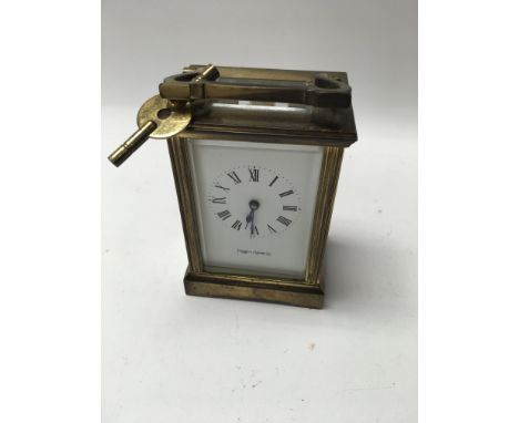 A brass case Mappin and Webb carriage clock .