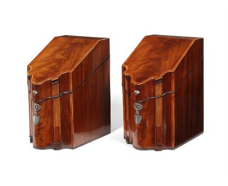 A pair of George III mahogany, rosewood crossbanded and chequerbanded serpentine knife boxes Each with sloping shaped lids en