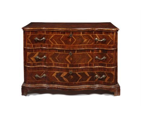 A rare mid 18th century North Italian carrubo (carob) wood and walnut commode en arbalète Inlaid with fruitwood bands, the sh