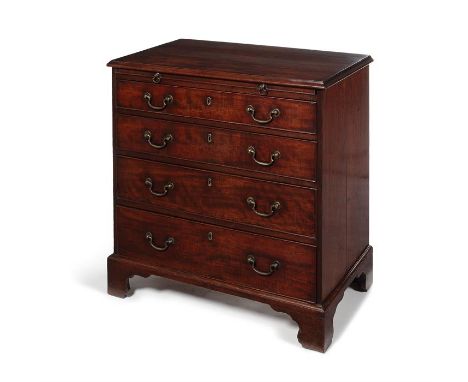 A small George III mahogany chest The rectangular moulded top above a slide and four long graduated drawers on shaped bracket