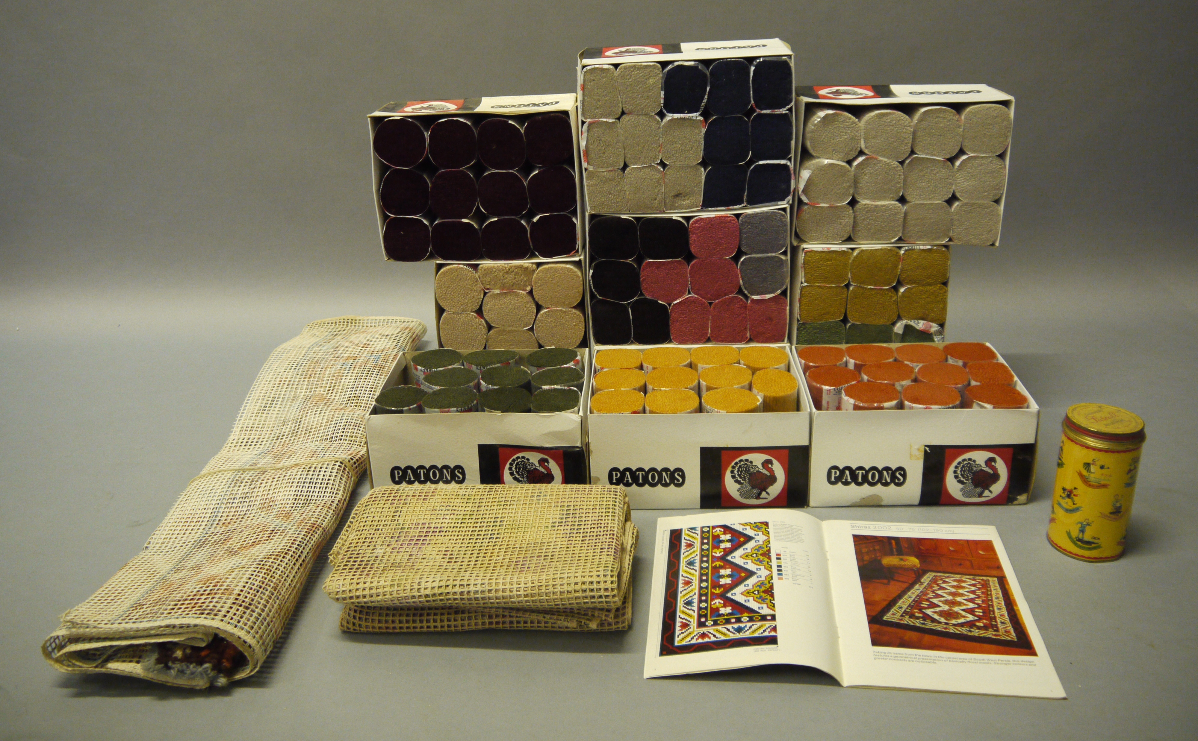 Ten boxes of Patons Turkey rug wool, together with stencilled canvases (2)