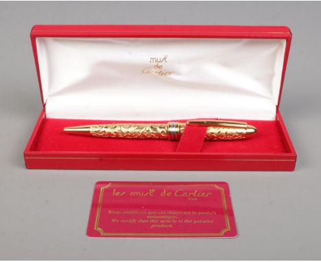 Le Must De Cartier, a gold plated ball point pen with box and authenticity card.  