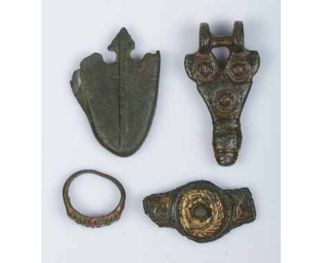 Four metal detector finds; scabbard chape, brooch, bronze ring and one other bronze item.  