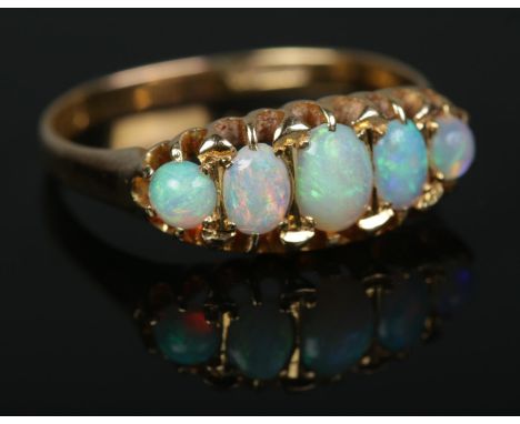 An 18ct gold five stone opal ring3.34gSize R1/2  