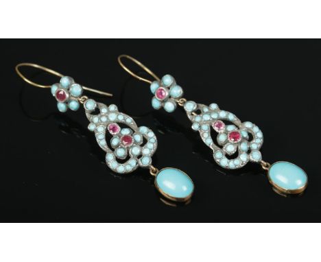 A pair of high carat yellow gold and white metal earrings, set with turquoise and ruby coloured stones. 8.73g.  