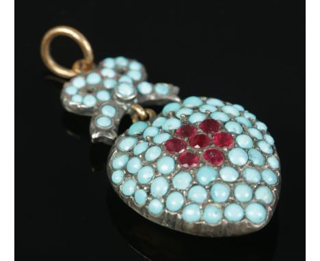 A high carat yellow gold and white metal pendant formed as a bow and heart. Set with turquoise and ruby stones. Approximately