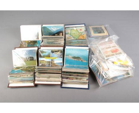 Six small albums of vintage postcards contained in several albums, including examples of English towns and villages, coastal 
