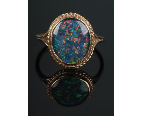 An 18ct gold ring set with large opal triplet. 3.76gO1/2  