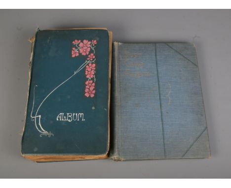 Two albums containing a good collection of mostly early to mid 20th century postcards to include Tucks, Misch &amp; Co, Inter