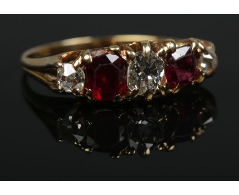 A Victorian 18ct gold, diamond and ruby five stone ring. Size M. Central diamond approx .25ct. 2.63g.  