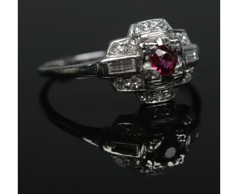 An Art Deco iridium and platinum, ruby and diamond ring. Size P. 3.58g.  