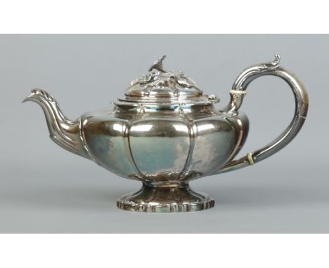 A William IV silver teapot with floral finial. Assayed London 1836 by Edward Barton. 702g. Ivory Submission Reference HZFV7B2