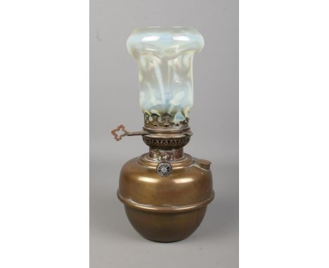 A Veritas oil lamp with vaseline glass shade. Largest opening on shade 9cm.  Nibbles to shade base, slight scratches. Lamp de