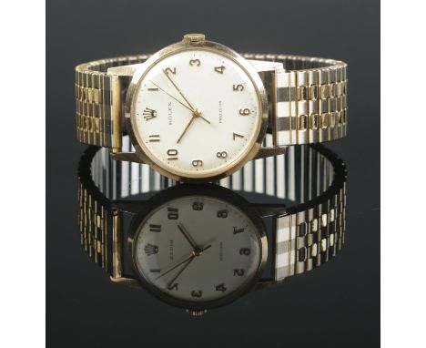 A gents 9ct gold Rolex Precision manual wristwatch on gold plated expanding strap. With guarantee booklet, purchase date 1970