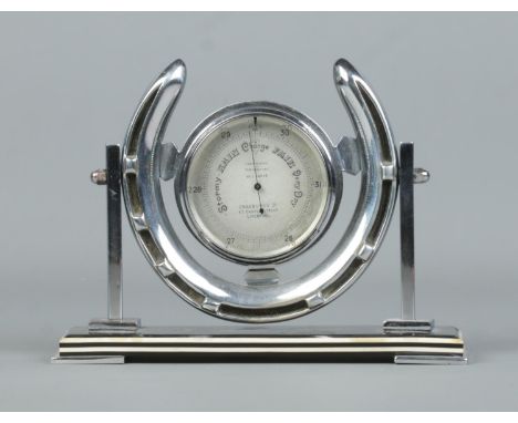 A Chadburns Art Deco desk barometer set in chrome horseshoe stand. Height 13cm.  