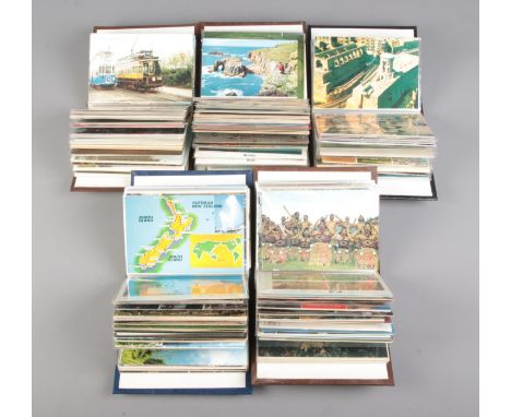 Five small albums of vintage postcards contained in several albums, including examples of English towns and villages, French 