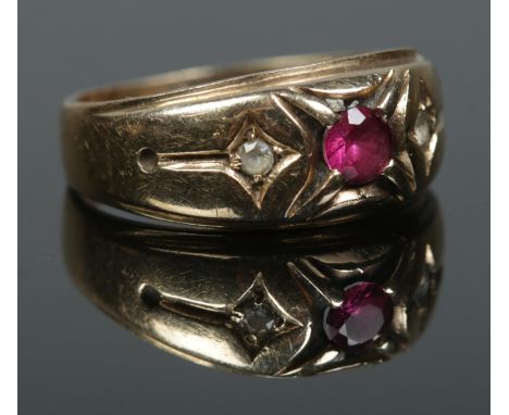 A 9ct gold ruby and paste gypsy style ring. Size T. 5.03g.  