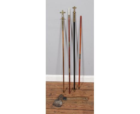 A collection of short staffs to include two examples each topped with a brass crucifix, possibly processional examples. Also 