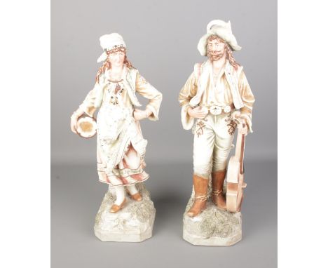 A pair of Royal Dux style ceramic figural vases formed as travelling musicians, both stamped JM6523 to base. Approx. height o