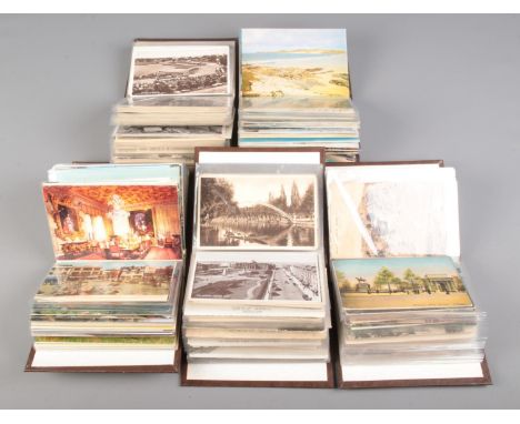 Five small albums of vintage postcards contained in several albums, including examples of English towns and villages, T Turne