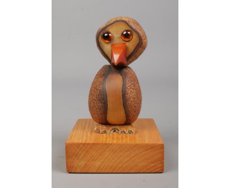 A vintage YZ style Tagua nut bird on oak plinth. Height 10cm.  
