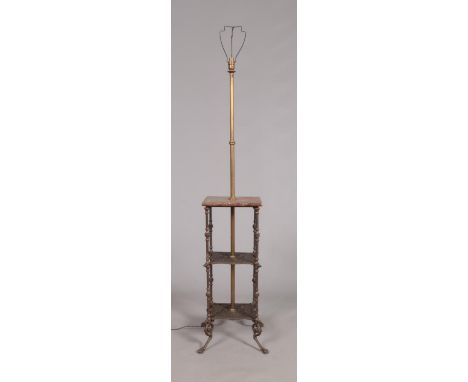 An early 20th century iron, marble and brass three tier standard lamp.  