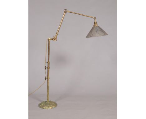 A Victorian brass multi adjusting anglepoise standard lamp. Having conical glass shade. Extended height 195cm.  Overall condi