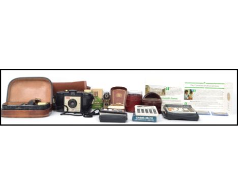 A mixed lot to include vintage Casio calculators, leather case chemists phial glass measure, Coronet midget camera, vintage g