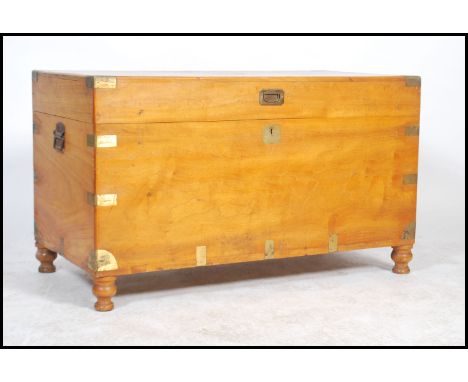 19th Century camphor wood trunk with brass and wooden bandings and iron end handles. Measures: 86cm high x 112cm wide x 59cm 